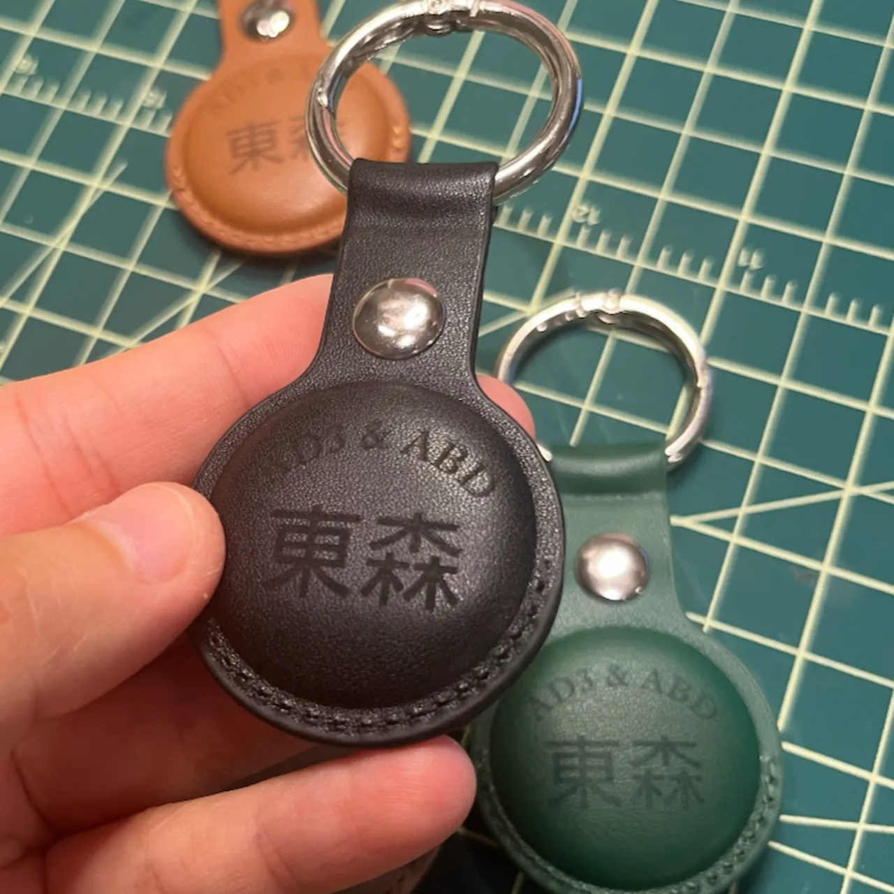 Black PU Leather Keychain for Apple Airtags Holder test grid